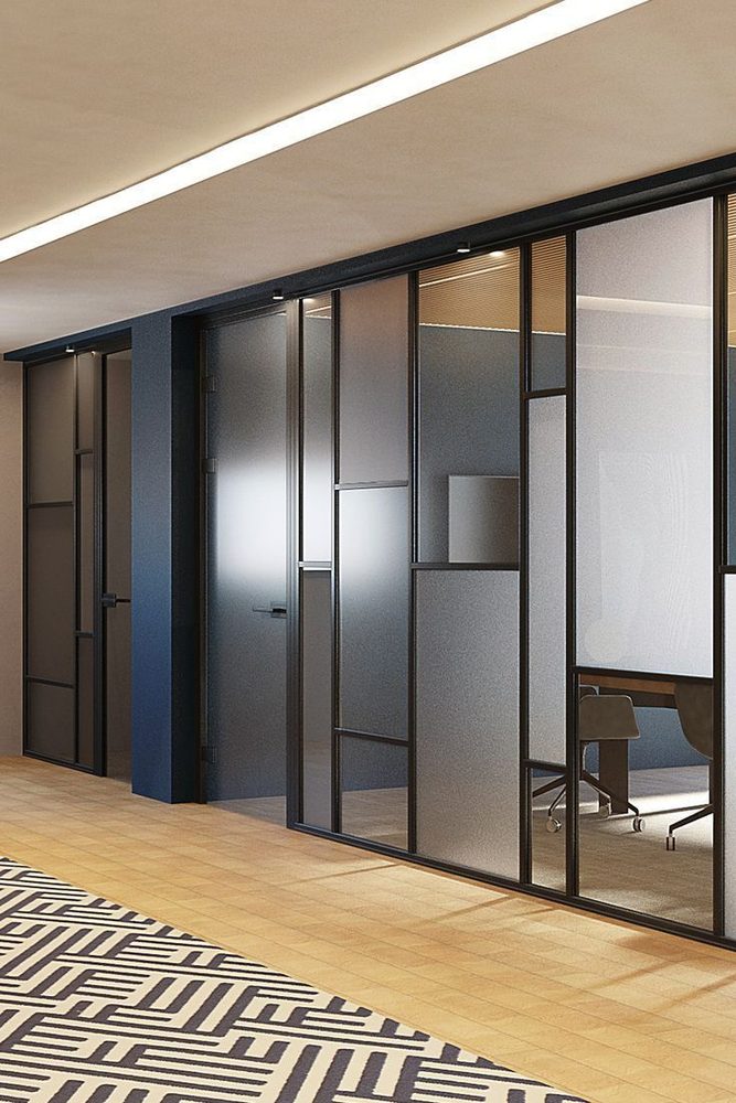 Aluminium partition carpentry in Dubai — frosted glass office partitions with slim black aluminium framing