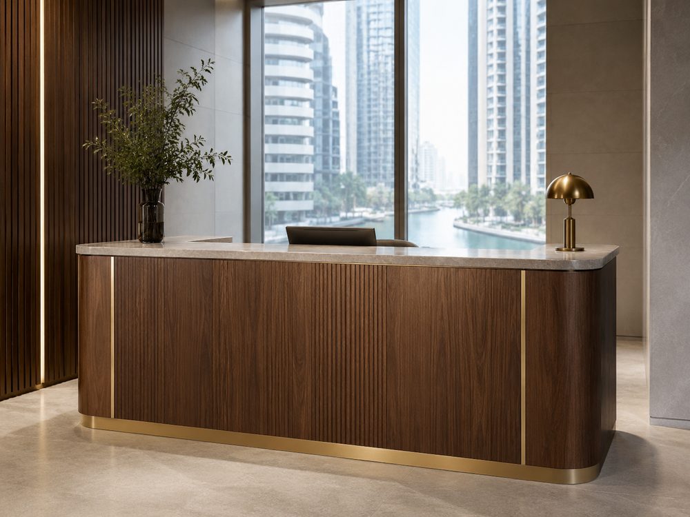 Carpenter in Business Bay Dubai — custom walnut reception counter with stone top and brass detail, overlooking the Dubai Canal